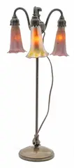 Adjustable Three-Light Lily Lamp, Depth 7.25" by Tiffany Studios, 2000, and the Tiffany Glass & Decorating Co. monogram to the underside, sold Dec 2024