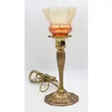 Furnaces Inc Bronze Lamp by Louis Comfort Tiffany, Gilt bronze lamp with Favrile shade, sold May 2025