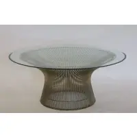 For Knoll Coffee Table by Warren Platner, A steel wire molded basket base and round glass top with beveled edge, sold May 2021