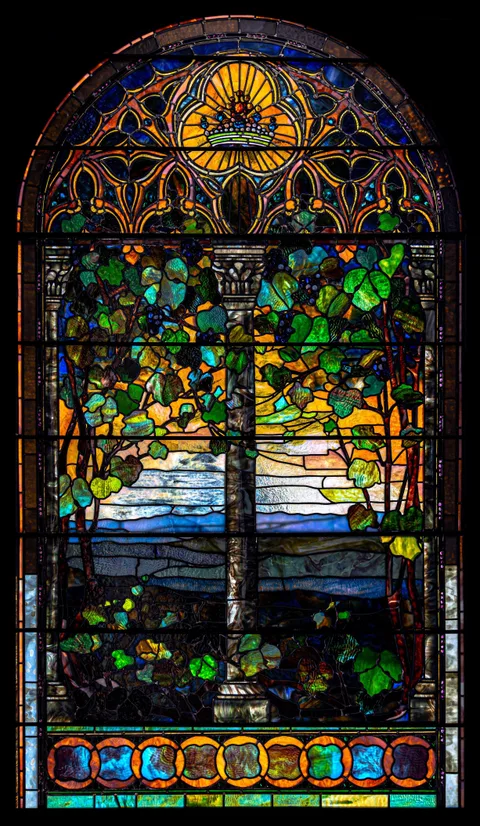 Tiffany Studios, Leaded Glass Romanesque Ornamental Window, circa 1890, including jeweled and rippled glass elements