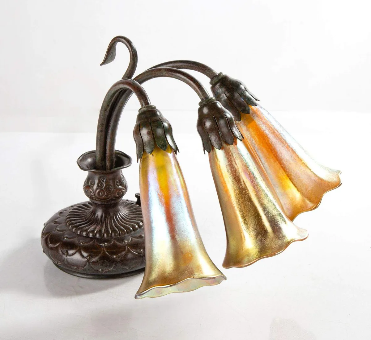 Three-Light Lily Table Lamp by Tiffany Studios, 1910, Favrile glass, sold May 2024