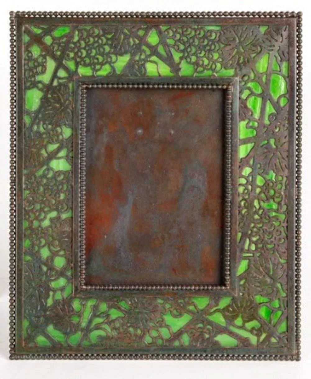 Picture Frame by Tiffany Studios, Favrile glass and bronze with greenish-brown patina, sold Nov 2020