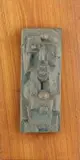Abstract Plaque by Edoardo Villa, bronze with a verdigris patina, mounted on a wooden base, sold Jun 2015