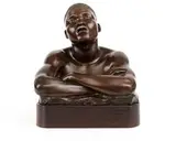 Anton van Wouw, The Sleeping African, bronze with a brown patina, mounted on a wooden base