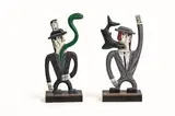 Norman Catherine, Truth and Lies, a pair, carved and painted wood