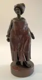 Jean Doyle, Voluptuous Woman, bronze with a brown and rust patina; mounted on a marble base