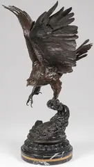Eagle by Jules Moigniez, Bronze with dark brown patina, resting on a vintage carved marble base banded with leaf tips, sold Jun 2020