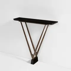 Console table by Gilbert Poillerat, designed circa 1954, Patinated wrought iron, Belgian black stone, sold Dec 2023