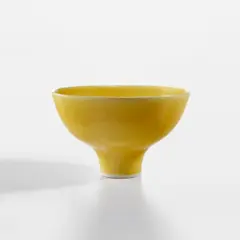Footed bowl by Lucie Rie, circa 1980, Porcelain, "American" yellow glaze, offered Dec 2023