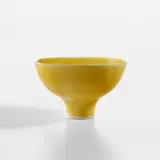 Footed bowl by Lucie Rie, circa 1980, Porcelain, "American" yellow glaze, offered Dec 2023