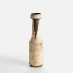 Hans Coper, Early narrow bottle, circa 1952, Stoneware, layered white porcelain slips and engobes over a textured and incised body, the neck with a triangular manganese glaze decoration