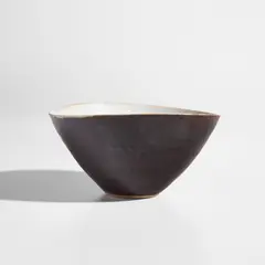 Bowl by Lucie Rie, circa 1965, Stoneware, pure manganese glaze exterior and white glaze with integrated manganese speckle interior, sold Feb 2022