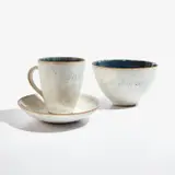 "Johnny" bowl and "Johnny" cup and saucer by Lucie Rie, circa 1949, Stoneware, cobalt blue and white glazes with an integral brown and blue speckle, cup and bowl inlaid JOHNNY, sold Jul 2022