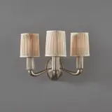Émile-Jacques Ruhlmann, "Lotus" wall light, model no. 3056 AR/3668 NR, circa 1926, Nickel-plated bronze, fabric shades