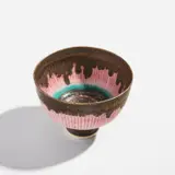 Footed bowl by Lucie Rie, circa 1980, Porcelain, inlaid pink radiating lines, turquoise and manganese bands, sold Dec 2022