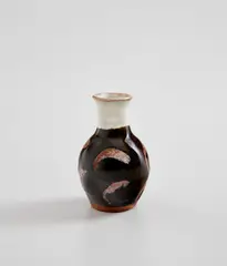 Sake bottle by Shoji Hamada, circa 1960, Stoneware, tenmoku and nuka glazes, sold Feb 2021