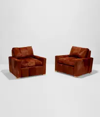 Peter Marino, Pair of club chairs, 2002, Hide upholstery, oak