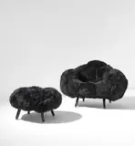 "Bolotas Armchair (Black)" and "Bolotas Ottoman (Black)" by Fernando Campana and Humberto Campana, 2015, Painted wood, sheep's wool upholstery, sold Jun 2021