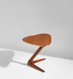 "Unicorn" side table by Vladimir Kagan, circa 1957, Walnut-veneered wood, walnut, brass, sold Jun 2021