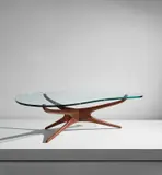 "Tri-symmetric" coffee table by Vladimir Kagan, circa 1953, Walnut, glass, sold Jun 2021
