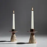Pair of candle holders by Hans Coper, circa 1955, Stoneware, layered porcelain slips with manganese glaze around the lip and interior, sold Dec 2021