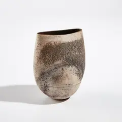Ovoid form by Hans Coper, circa 1969, Stoneware, layered porcelain slips and engobes over a textured and incised body, the interior with a manganese glaze, sold Dec 2021