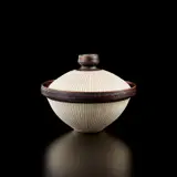 Covered bowl by Lucie Rie, circa 1958, Porcelain, radiating inlaid design and interior with matching sgrafitto design, manganese glaze on the interior, lip, an, sold Jul 2020