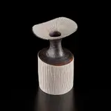 Vase with flaring lip by Lucie Rie, circa 1974, Porcelain, manganese glaze on shoulder and neck, inlaid lip and body, sold Jul 2020