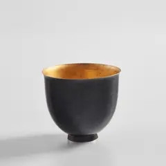 Footed cup by Jean Dunand, 1920s, Patinated metal, sold Jul 2020