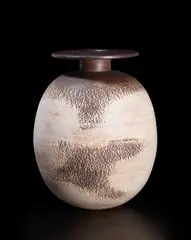 Hans Coper, Ovoid pot with disc, circa 1965, Stoneware, layered white porcelain slips and engobes over a body with textured and incised linear designs, the neck and disk with manganese glaze