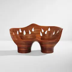 Settee by Wendell Castle, 2006, Stack-laminated walnut, sold Jul 2020