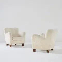 Fritz Hansen, Pair of armchairs, model no. 1669, 1940s, Stained beech, sheepskin upholstery