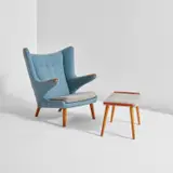 “Papa Bear” armchair, model no. AP19, and ottoman by Hans J. Wegner, designed 1951, Teak, fabric upholstery, sold Jul 2020