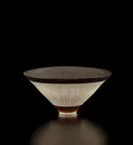 Large conical bowl by Lucie Rie, circa 1980, Porcelain with manganese glaze, radiating inlaid and sgraffito design, sold Dec 2020