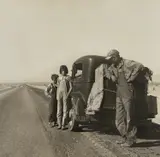 Oklahoma Sharecropper and Family Entering California. Stalled on the Desert Near Indio, California by Dorothea Lange, 1937, Gelatin silver print, sold Apr 2019