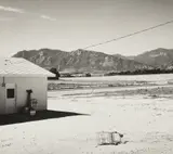 Robert Adams, Tract home and abandoned shopping cart. Colorado Springs, Colorado