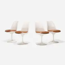 Eero Saarinen, Tulip chairs model 151, set of four, lacquered fiberglass, enameled aluminum, leather upholstery