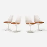 Eero Saarinen, Tulip chairs model 151, set of four, lacquered fiberglass, enameled aluminum, leather upholstery