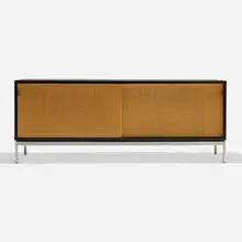 Florence Knoll, Sliding door cabinet, c. 1965, laminate over wood, cane, matte chrome-plated steel, maple, leather
