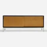 Florence Knoll, Sliding door cabinet, c. 1965, laminate over wood, cane, matte chrome-plated steel, maple, leather