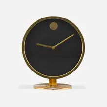 Table clock by Nathan George Horwitt, c. 1969-1970, brass, glass, enameled metal, sold Aug 2026
