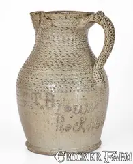 C.T. Brown, Exceptional Salt-and-Alkaline-Glazed Stoneware Pitcher w/ Profuse Punchwork, Inscribed "C.T. Brown / Rock MiLLS," Alabama, circa 1900, Alkaline-glazed stoneware