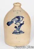 Fine J. & E. NORTON / BENNINGTON, VT Stoneware Jug w/ Bold Bird-on-Stump Decoration by J. & E. Norton, circa 1855, Stoneware, sold Apr 2024