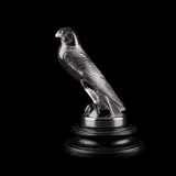 René Lalique (French, 1860-1945), 'Faucon', A Car Mascot, Designed 1925 by René Lalique, glass with an amethyst tint, moulded R, sold Sep 2024
