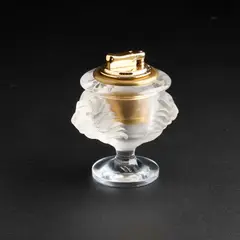 A Lalique Table Lighter by Lalique, glass, sold Jul 2024