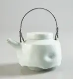 Teapot by Edmund de Waal, circa 1995, Porcelain, celadon glaze, galvanized metal, sold Dec 2019