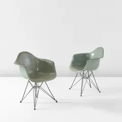 Charles Eames and Ray Eames, Pair of "DAR" armchairs, circa 1953, Molded fiberglass, painted steel, rubber
