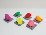 Six Small Mountains by Ugo Rondinone, 2016, painted stone on concrete base, in 12 parts, sold Feb 2018
