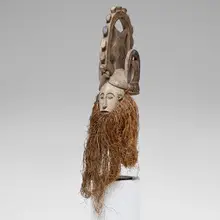 Igbo, Agbogbo Mmuo (white spirit or maiden) mask, carved wood, pigment, raffia