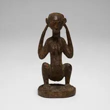 Crouching figure by Luba or Lulua, carved wood, sold Aug 2026